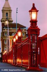 ID 1886 PORT OF AUCKLAND, NZ - Running the length of Quay Street, the famous red fence separates the port estate from downtown Auckland's commercial heart. It was erected during the infamous waterfront strike...